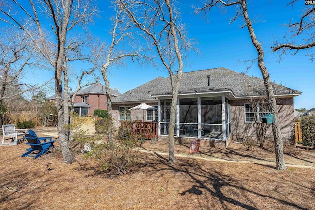 rear view of house with a sunroom