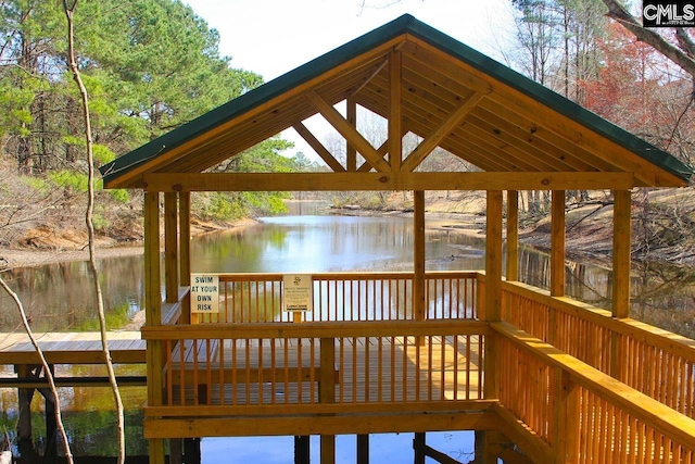 exterior space featuring a gazebo and a water view