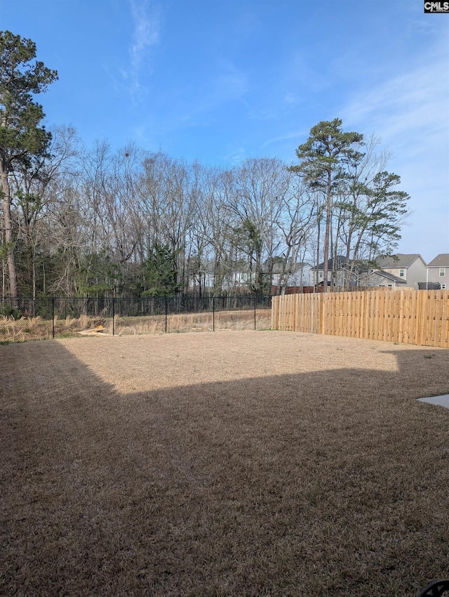 view of yard featuring fence