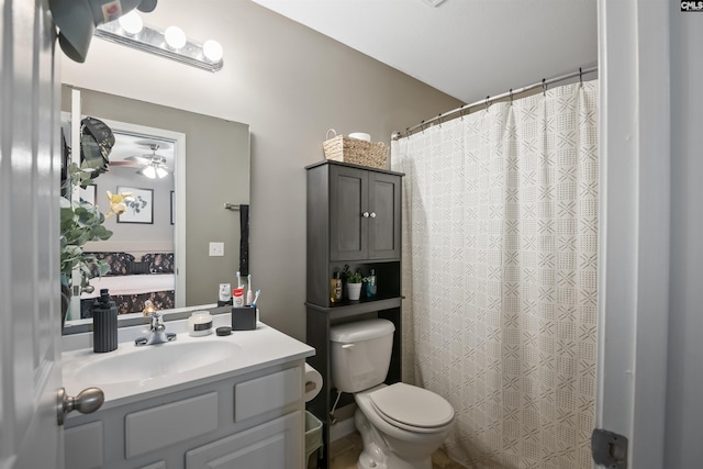 full bath with vanity, curtained shower, and toilet