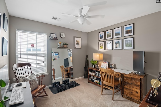 office space with baseboards, visible vents, carpet floors, and ceiling fan