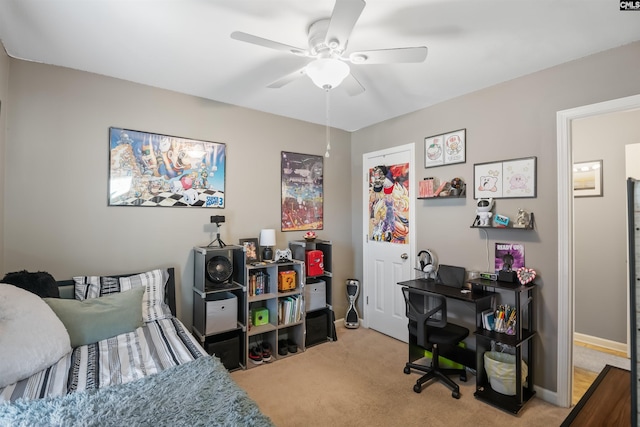 carpeted bedroom with baseboards and ceiling fan