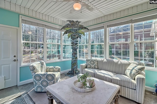 sunroom featuring a ceiling fan