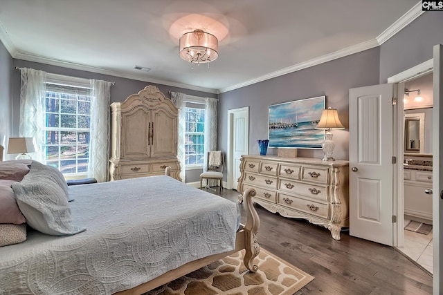 bedroom with visible vents, dark wood-style flooring, and crown molding