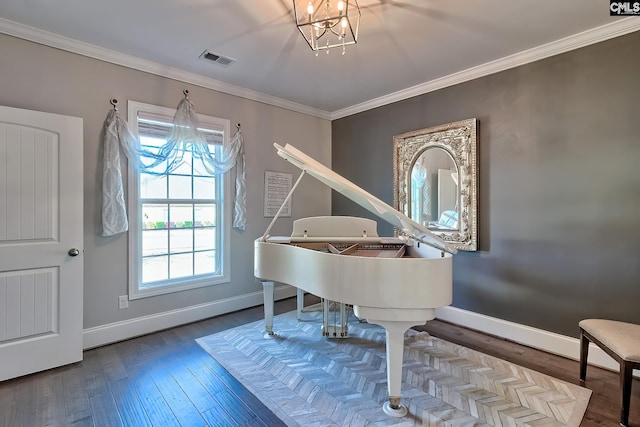 sitting room with visible vents, baseboards, crown molding, and an inviting chandelier