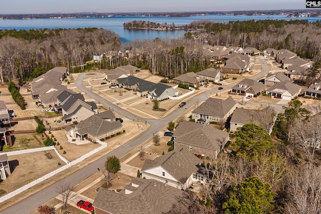 bird's eye view featuring a residential view and a water view