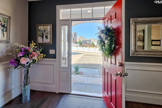 entryway with wainscoting and dark wood-type flooring