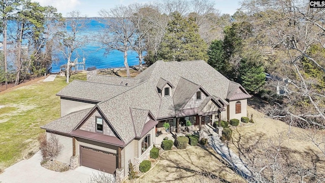 birds eye view of property featuring a water view