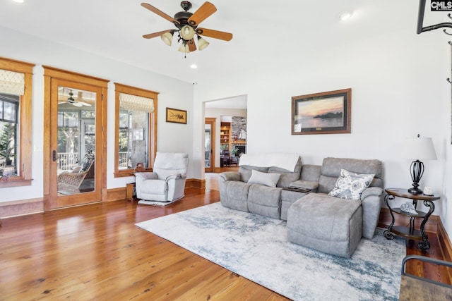 living area featuring recessed lighting, baseboards, a ceiling fan, and wood finished floors