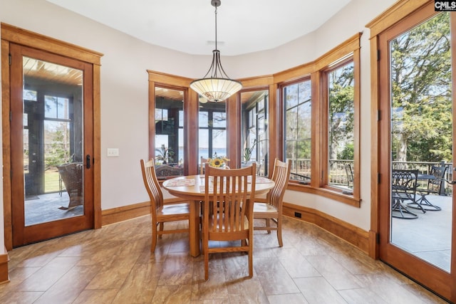 dining area with a wealth of natural light and baseboards