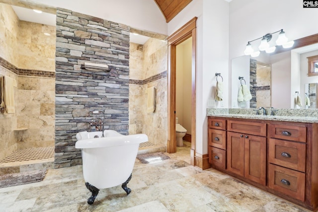 bathroom with a walk in shower, a freestanding bath, toilet, lofted ceiling, and vanity