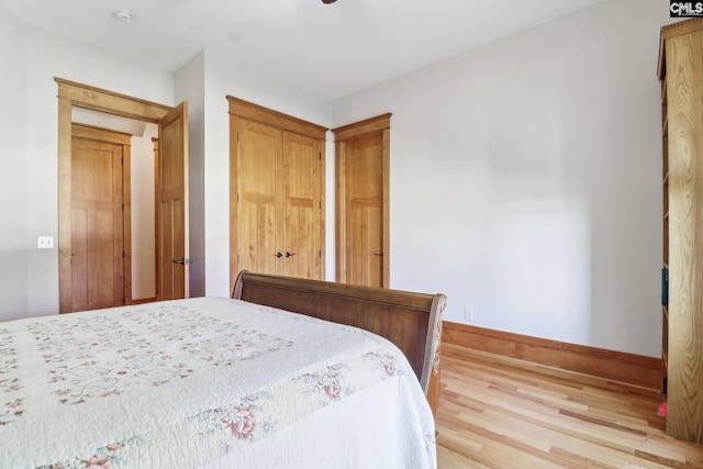 unfurnished bedroom featuring light wood finished floors and baseboards