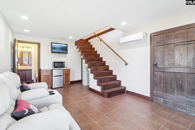 living room featuring tile patterned flooring, baseboards, stairway, an AC wall unit, and recessed lighting