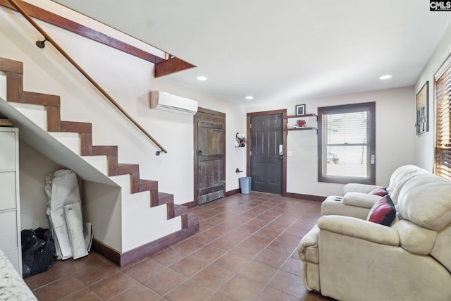 living room with stairway, recessed lighting, an AC wall unit, and dark tile patterned flooring