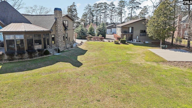 view of yard featuring a sunroom