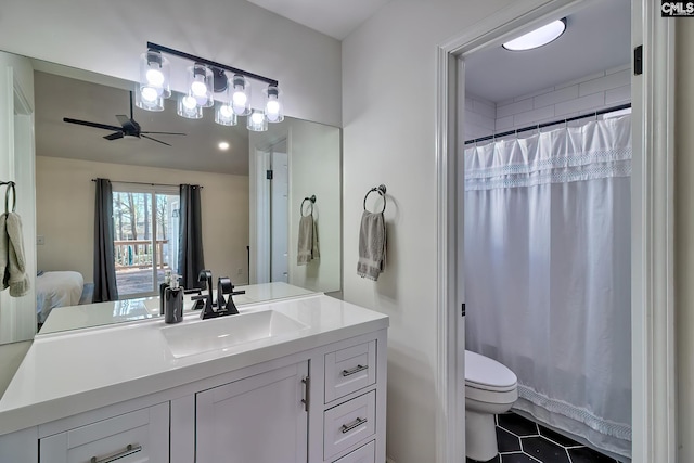 full bathroom featuring toilet, curtained shower, vanity, and a ceiling fan