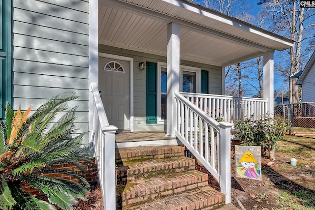 property entrance with covered porch