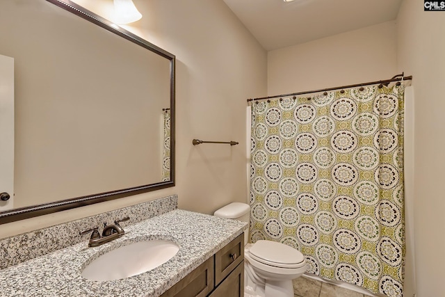 bathroom featuring a shower with shower curtain, toilet, vanity, and tile patterned flooring