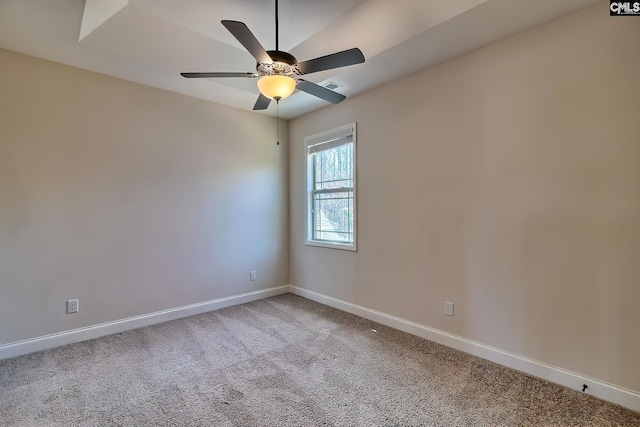 spare room featuring a ceiling fan, visible vents, carpet, and baseboards