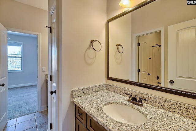 bathroom with tile patterned floors, baseboards, vanity, and a shower with curtain