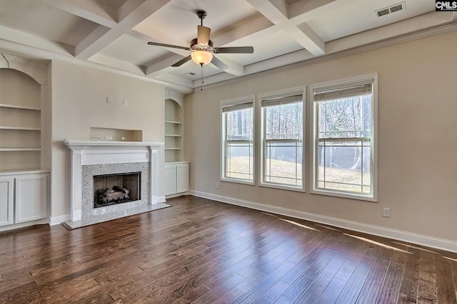 unfurnished living room featuring dark wood finished floors, baseboards, visible vents, and ceiling fan