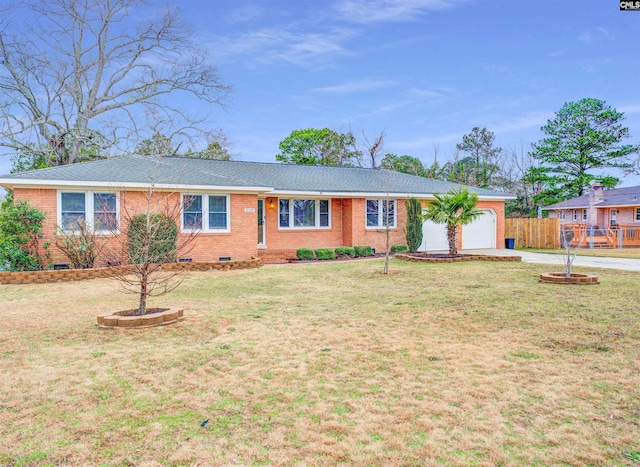 ranch-style home featuring a front lawn, fence, driveway, crawl space, and an attached garage