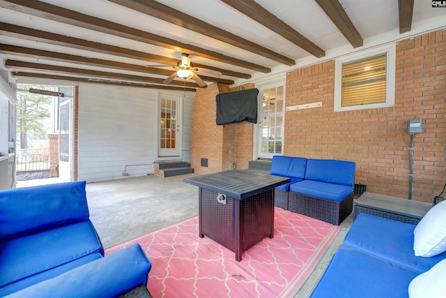 view of patio with an outdoor living space, entry steps, and ceiling fan