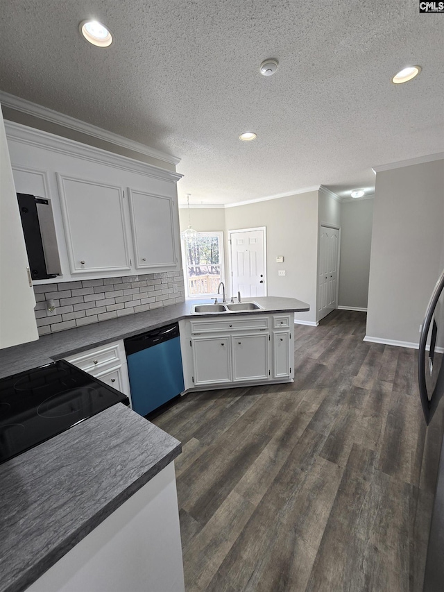 kitchen with dishwashing machine, a peninsula, ornamental molding, a sink, and white cabinetry