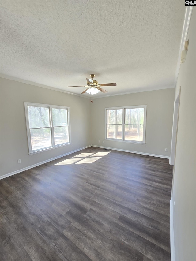 unfurnished room with a wealth of natural light, baseboards, and dark wood-style floors