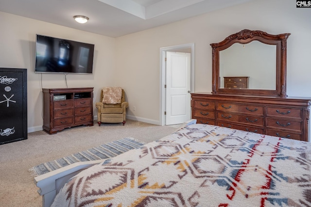 carpeted bedroom featuring baseboards