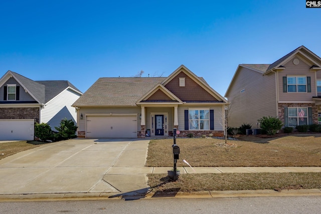 craftsman house featuring stone siding, concrete driveway, and a garage