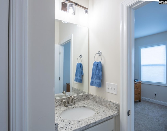 bathroom featuring vanity and baseboards