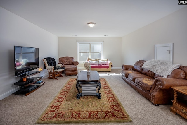 carpeted living area featuring baseboards