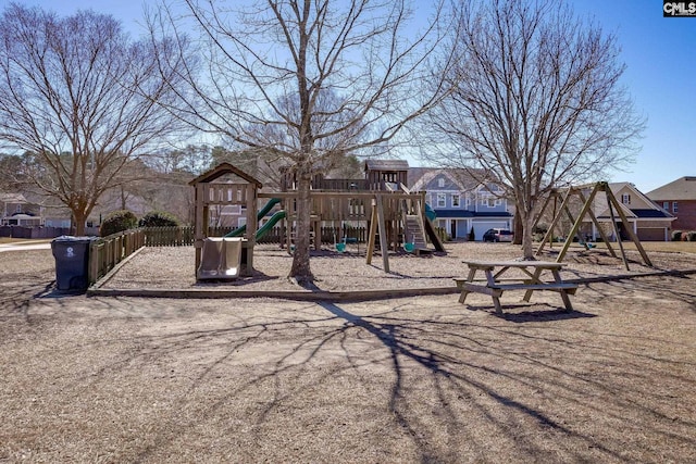 community play area with fence and a residential view