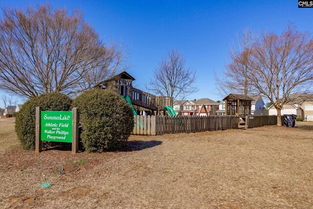 view of yard with fence and playground community