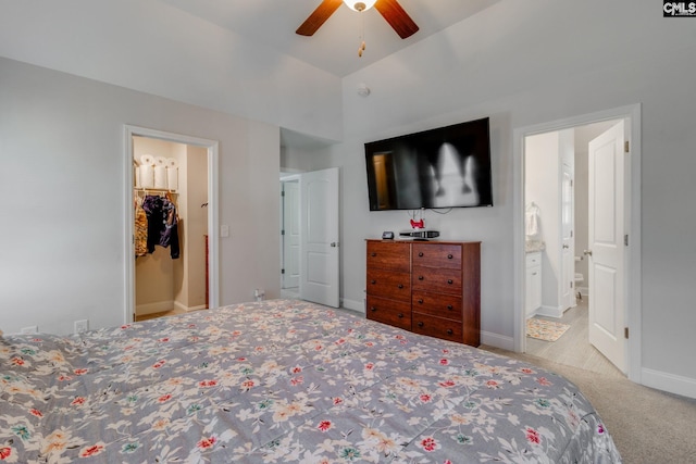 carpeted bedroom with baseboards, ceiling fan, and ensuite bathroom