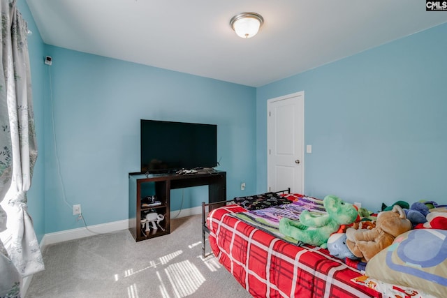 carpeted bedroom with baseboards