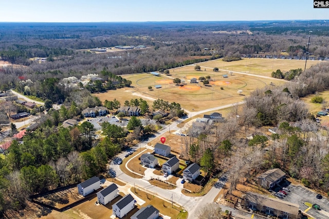 aerial view featuring a view of trees