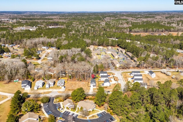 aerial view with a residential view and a view of trees