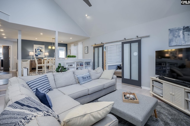 living area featuring recessed lighting, high vaulted ceiling, baseboards, and wood finished floors