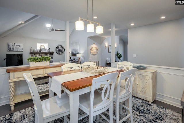 dining room featuring visible vents, a wainscoted wall, lofted ceiling, recessed lighting, and dark wood-style flooring