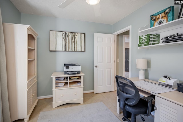 office with light tile patterned flooring, baseboards, a textured ceiling, and ceiling fan