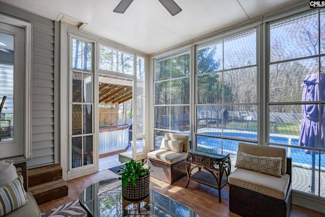 sunroom / solarium with ceiling fan