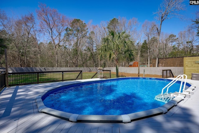 view of swimming pool featuring a fenced in pool and a fenced backyard