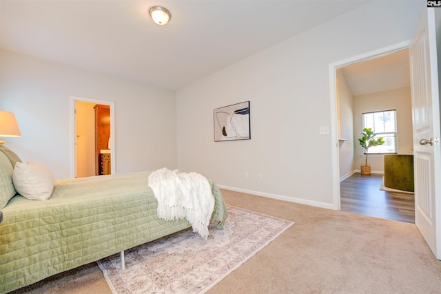 carpeted bedroom with baseboards