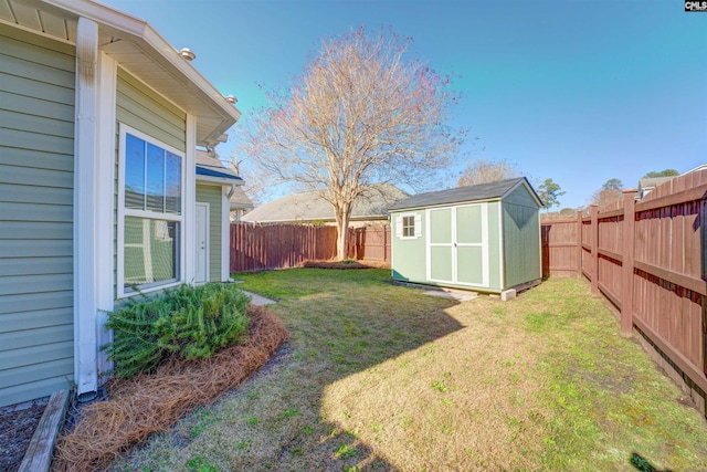 view of yard featuring a fenced backyard, a shed, and an outdoor structure