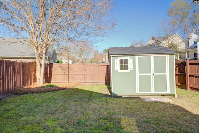 view of shed with a fenced backyard