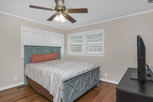 bedroom with visible vents, baseboards, dark wood-type flooring, and crown molding