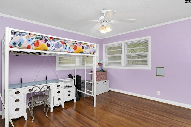 bedroom with a ceiling fan, wood finished floors, baseboards, ornamental molding, and a textured ceiling