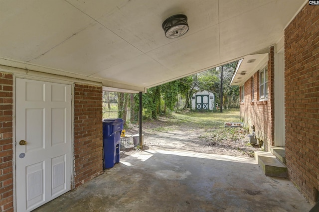 view of patio / terrace with a shed and an outdoor structure